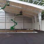 IMG-20110716-00082 The back wall is up and the roof on the courts is beginning. 7/15/11