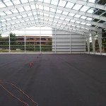 IMG-20110716-00084 The paving is complete and the front siding is going up! The Deco Turf system is next. 7/15/11